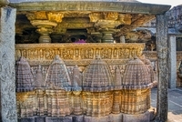 Carvings on the parapet wall - sequences from Mahabharata - Krishna's killing of various demons, Below the parapet wall - carved miniatures temple towers