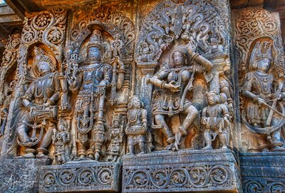 Lord Vishnu flanked by dancers and musicians - 101