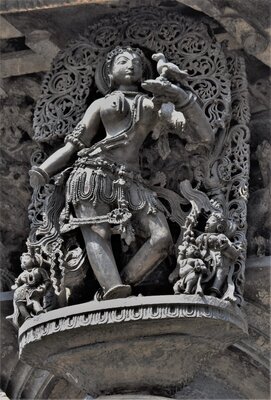 Chennakeshava temple, Beluru, Bracket figure, Shilabalike - shuka bhasini - girl talking to a parrot