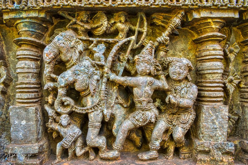 A elephant war scene from the Mahabharat, showing Arjuna (wearing a crown) with his famous bow, Gandiva, while Bhim wields his mace